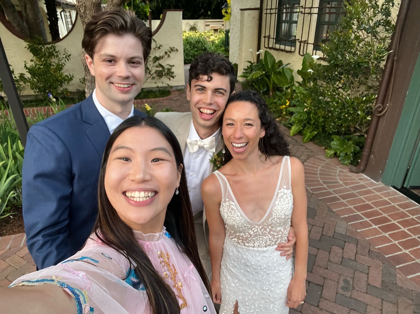 A guest selfie with the newlyweds outside the venue
