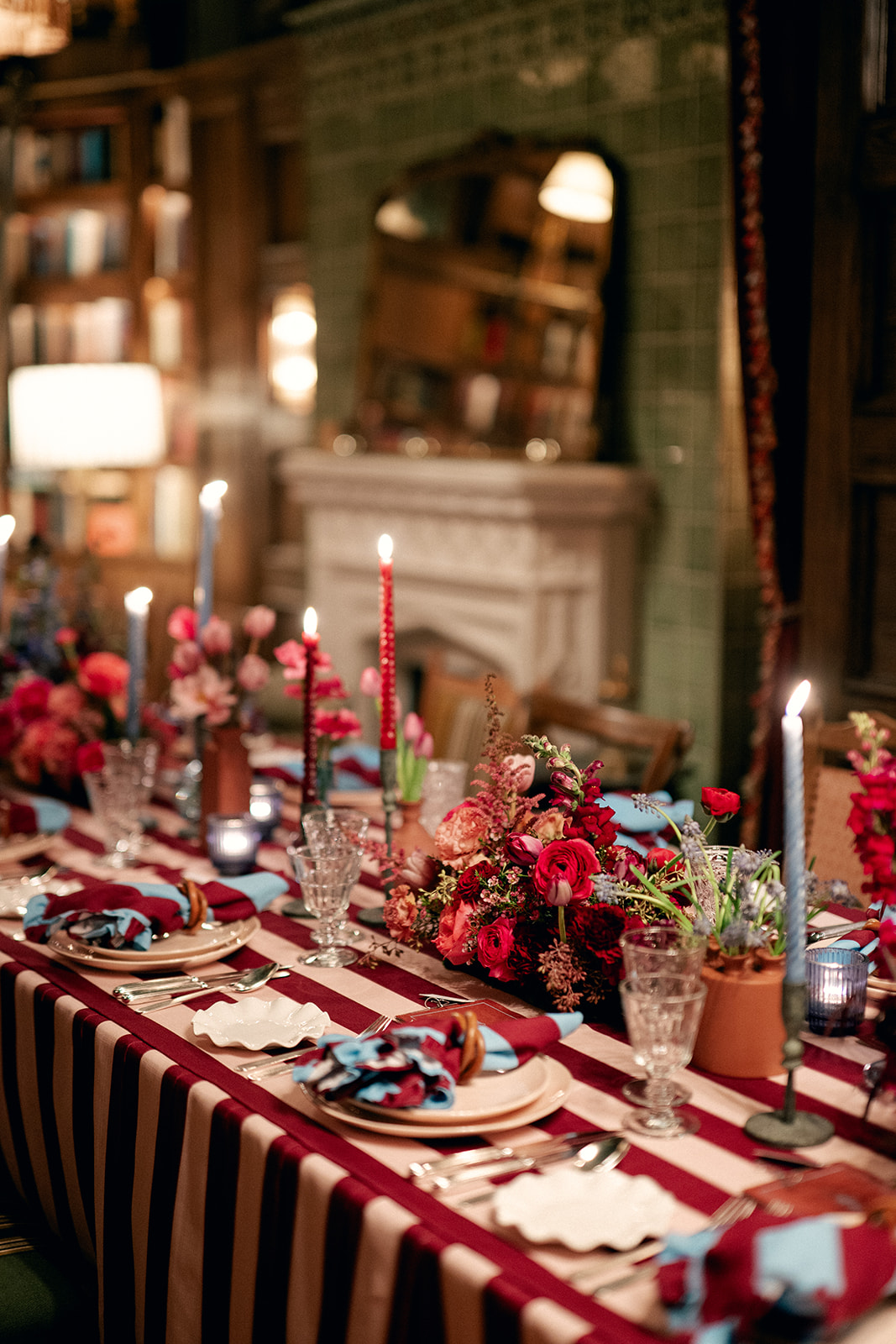 A candlelit reception table prepared for dinner